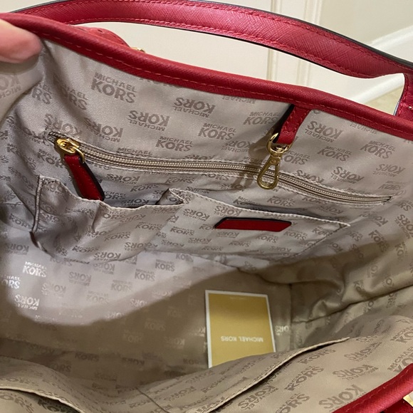 Michael Kors cherry red purse. VGUC, multiple pockets to neatly carry items. - Picture 7 of 13